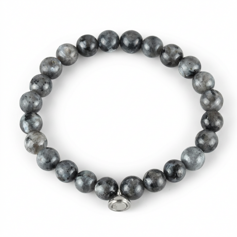 Studio shot of the glossy grey speckled bead bracelet with a silver magnetic charm on white 7
