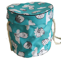 Large foldable toy tidy-up mat with basket function for the children's room.