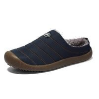 Single navy blue quilted slipper on white background, showing orange stitching and grey fleece lining 15