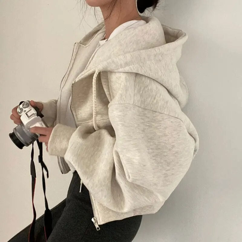 Ladies' short-cut vest with hood and oversized fit – Rinette
