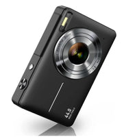 Black compact camera angled to show its silver lens ring, flash and top buttons 9