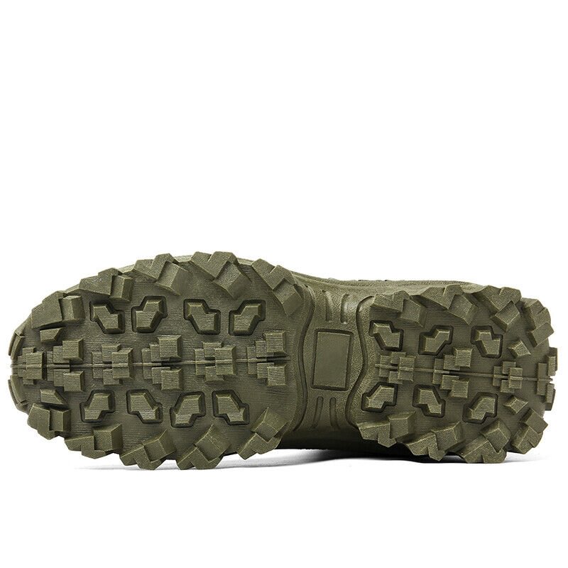Close view of an olive green boot's outsole, with deep chunky lugs and a central heel plate 22