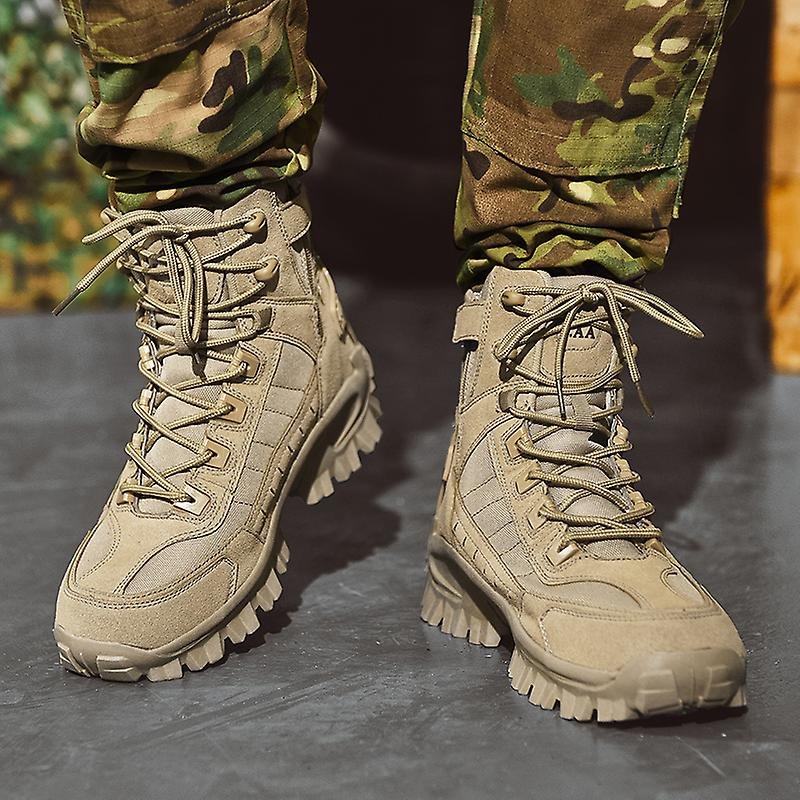 Front view of sand-coloured laced boots worn with camouflage trousers, showing side zip and strap on one boot 4