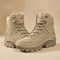 Pair of sand-coloured high-top boots angled towards each other on a beige studio background 24