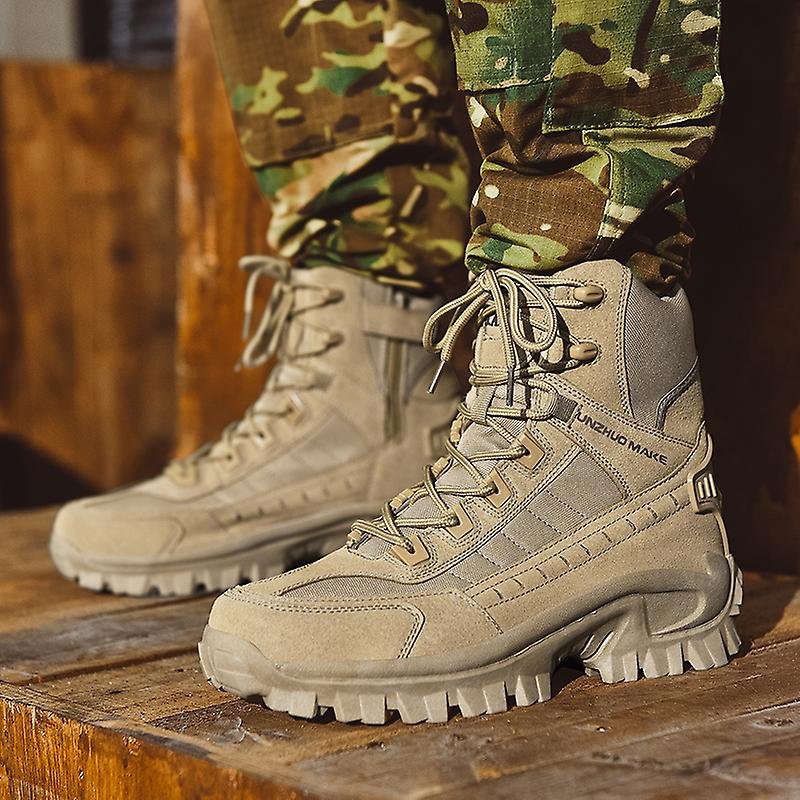 Sand-coloured suede and fabric high-top boots worn with camouflage trousers, standing on a wooden platform 2