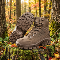 Brown suede hiking boot on a mossy stump, with a second boot showing its chunky tread 1