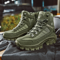 Pair of olive green tactical boots displayed on dark folded clothing with a blurred outdoor background 5