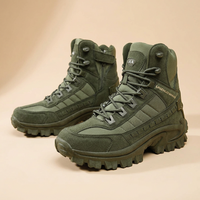 Olive green boots on a beige backdrop, with the left boot showing a side zip and strap 25