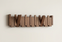 Dark wooden rack front view with two hooks angled outwards and the others flat 12